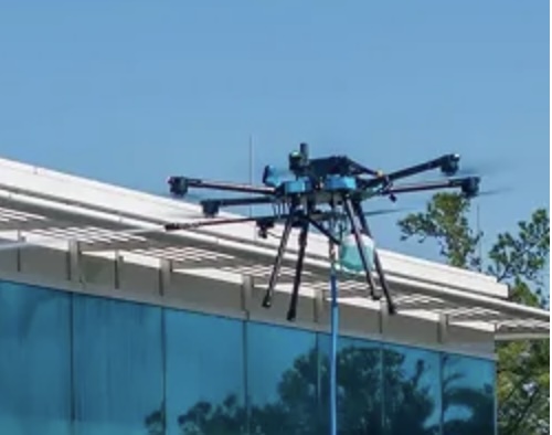 Drone cleaning a building façade